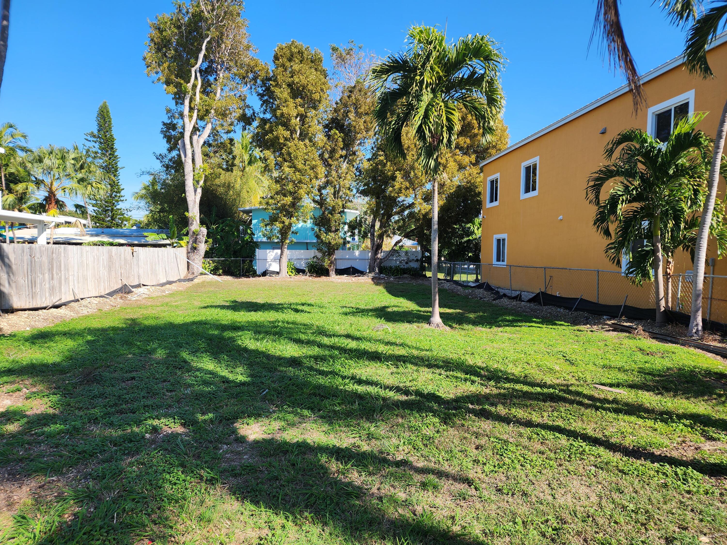 62 Southeast Marlin Avenue Key Largo, FL 33037 - Photo 4 of 14 a view of a backyard with a garden