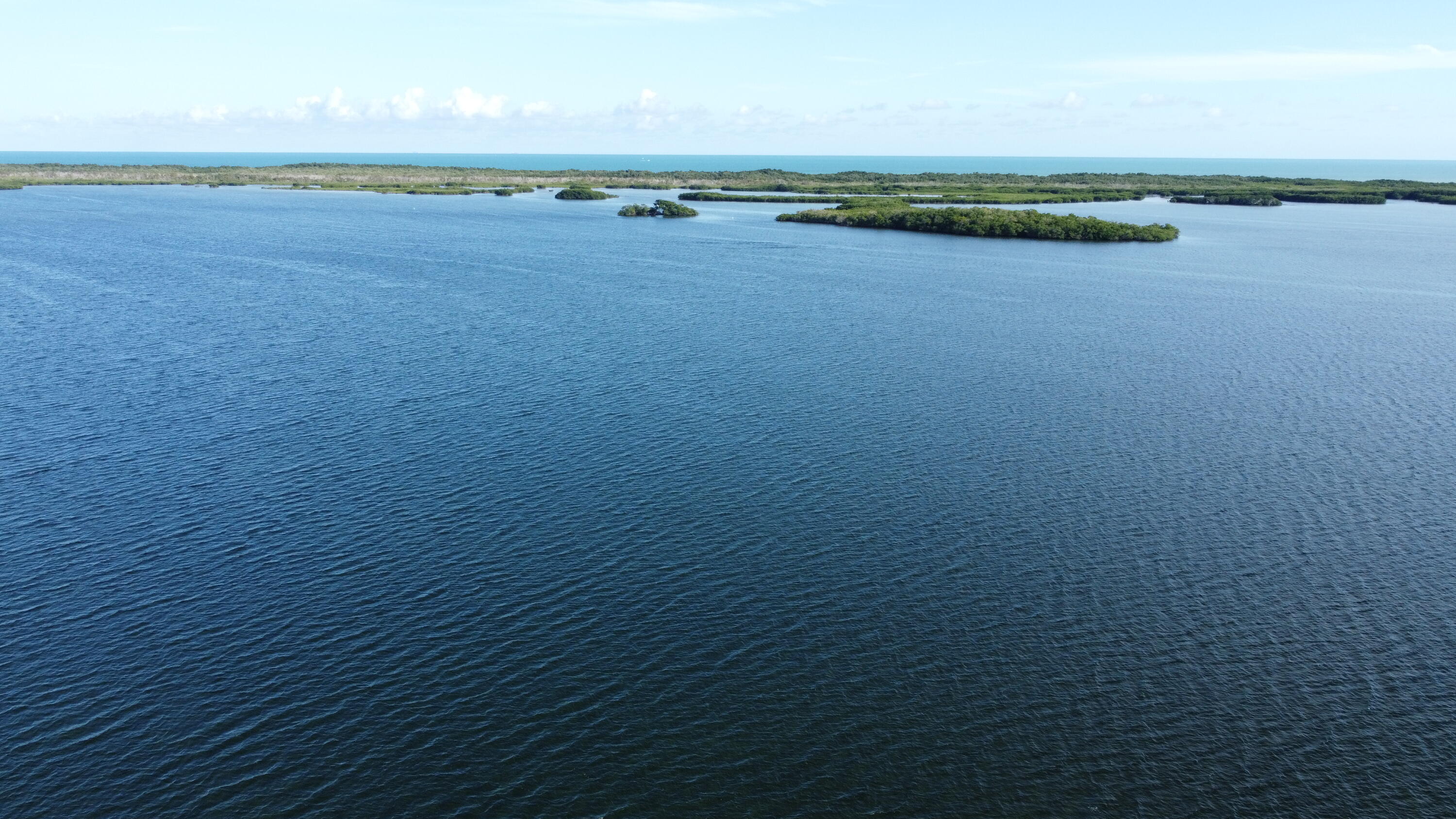 62 Southeast Marlin Avenue Key Largo, FL 33037 - Photo 7 of 14 a view of an ocean and beach