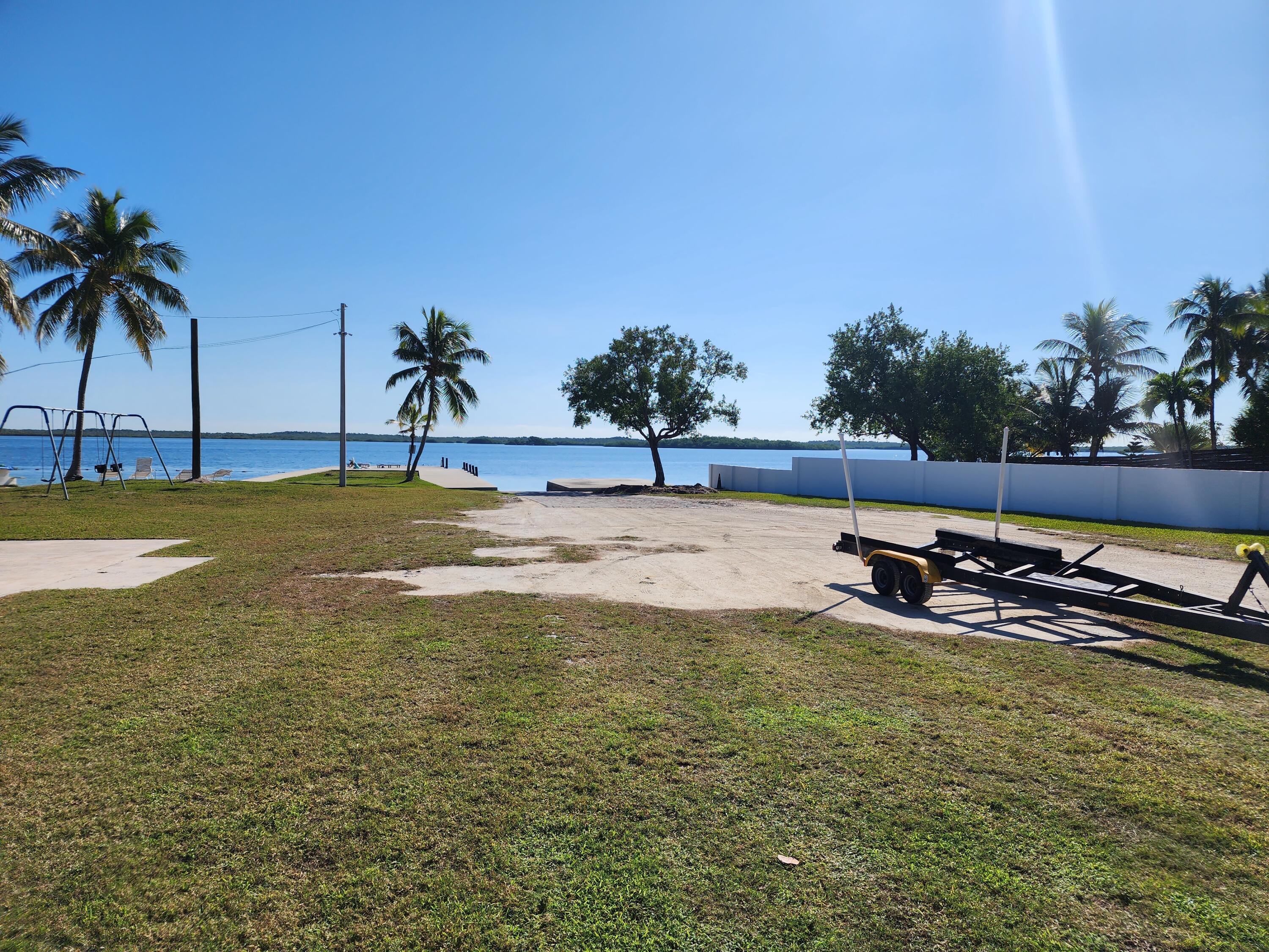 62 Southeast Marlin Avenue Key Largo, FL 33037 - Photo 10 of 14 a view of a swimming pool and an outdoor space