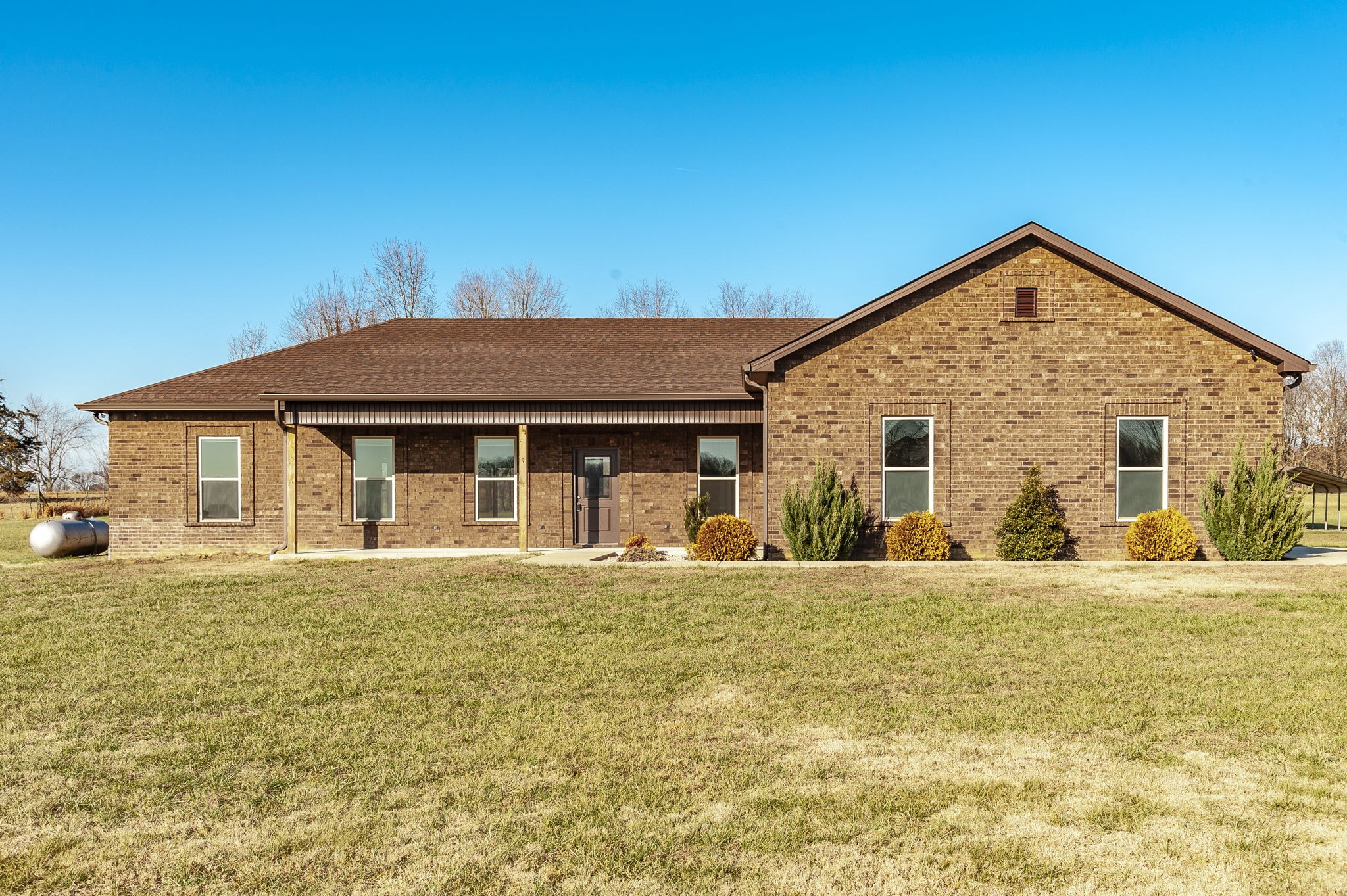 a front view of a house with a yard