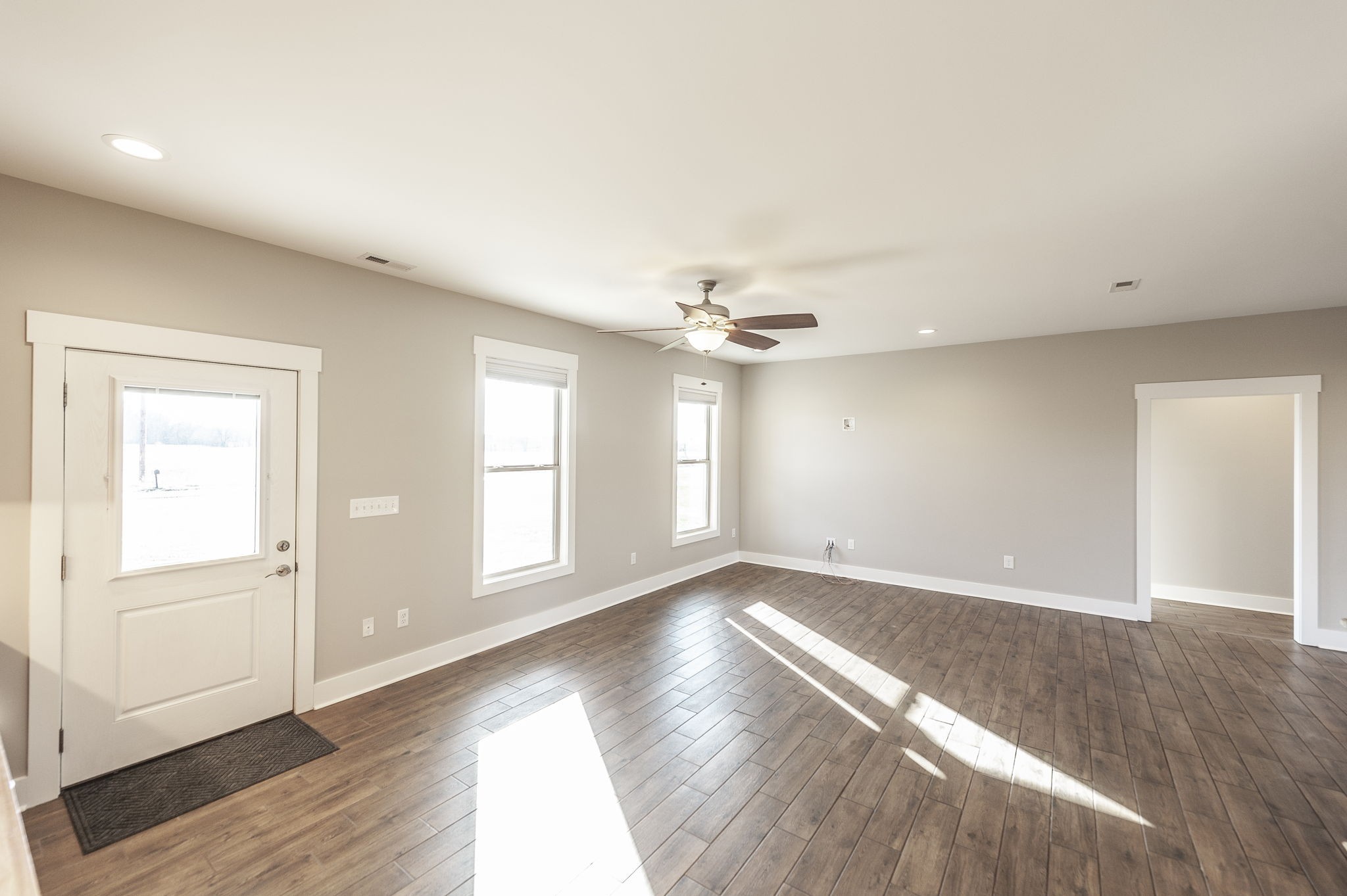 7728 Boyles Road White House, TN 37188 - Photo 19 of 60 an empty room with wooden floor cabinet and windows