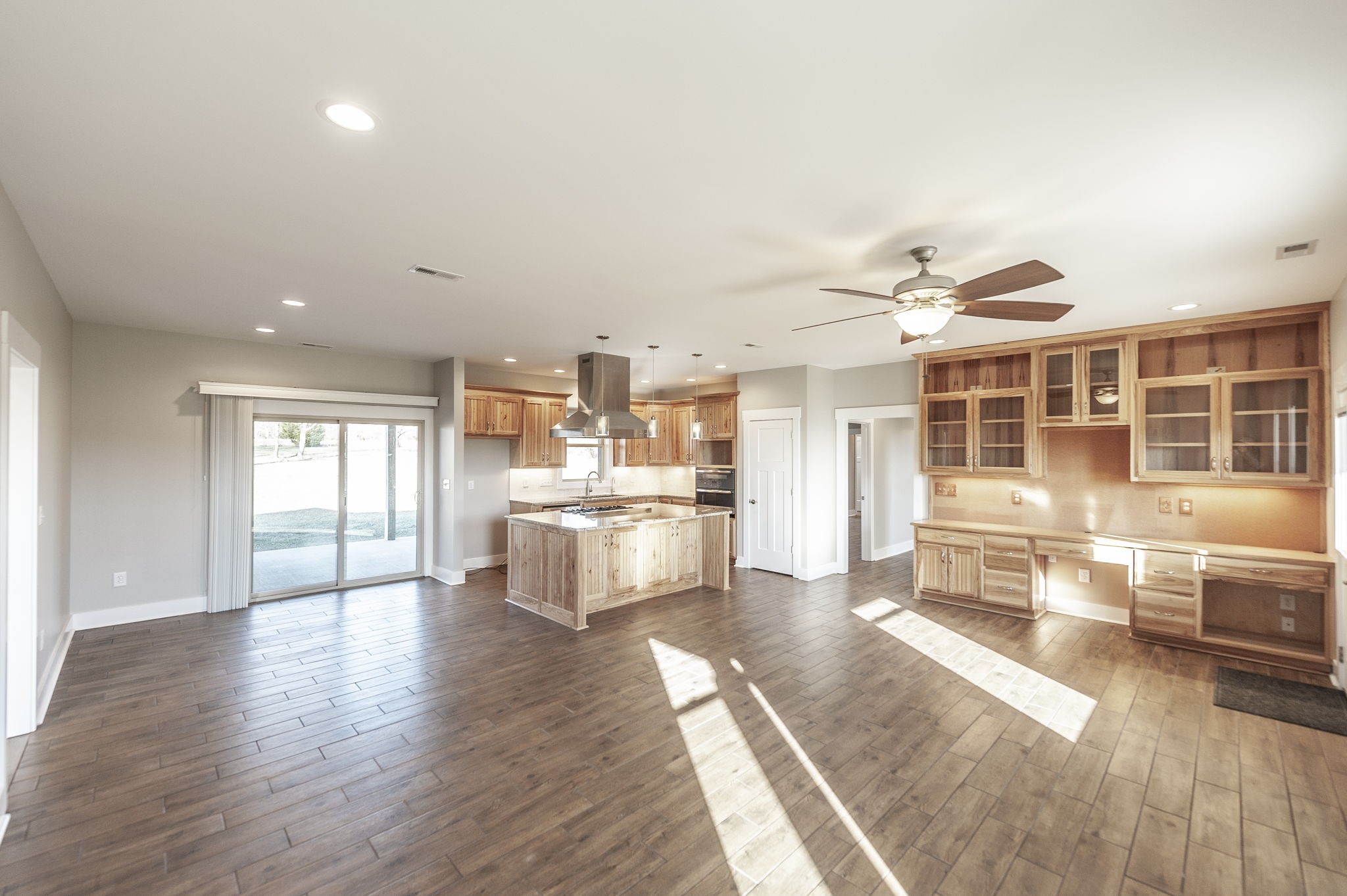 7728 Boyles Road White House, TN 37188 - Photo 20 of 60 a large living room with stainless steel appliances wooden floor and large windows