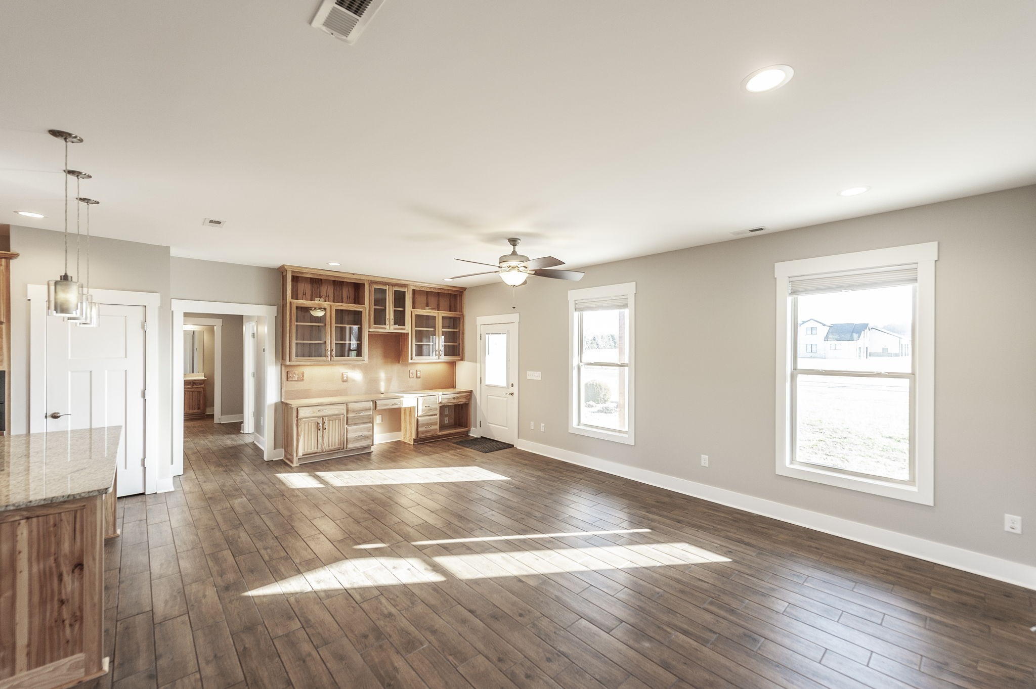 7728 Boyles Road White House, TN 37188 - Photo 21 of 60 an empty room with wooden floor and windows