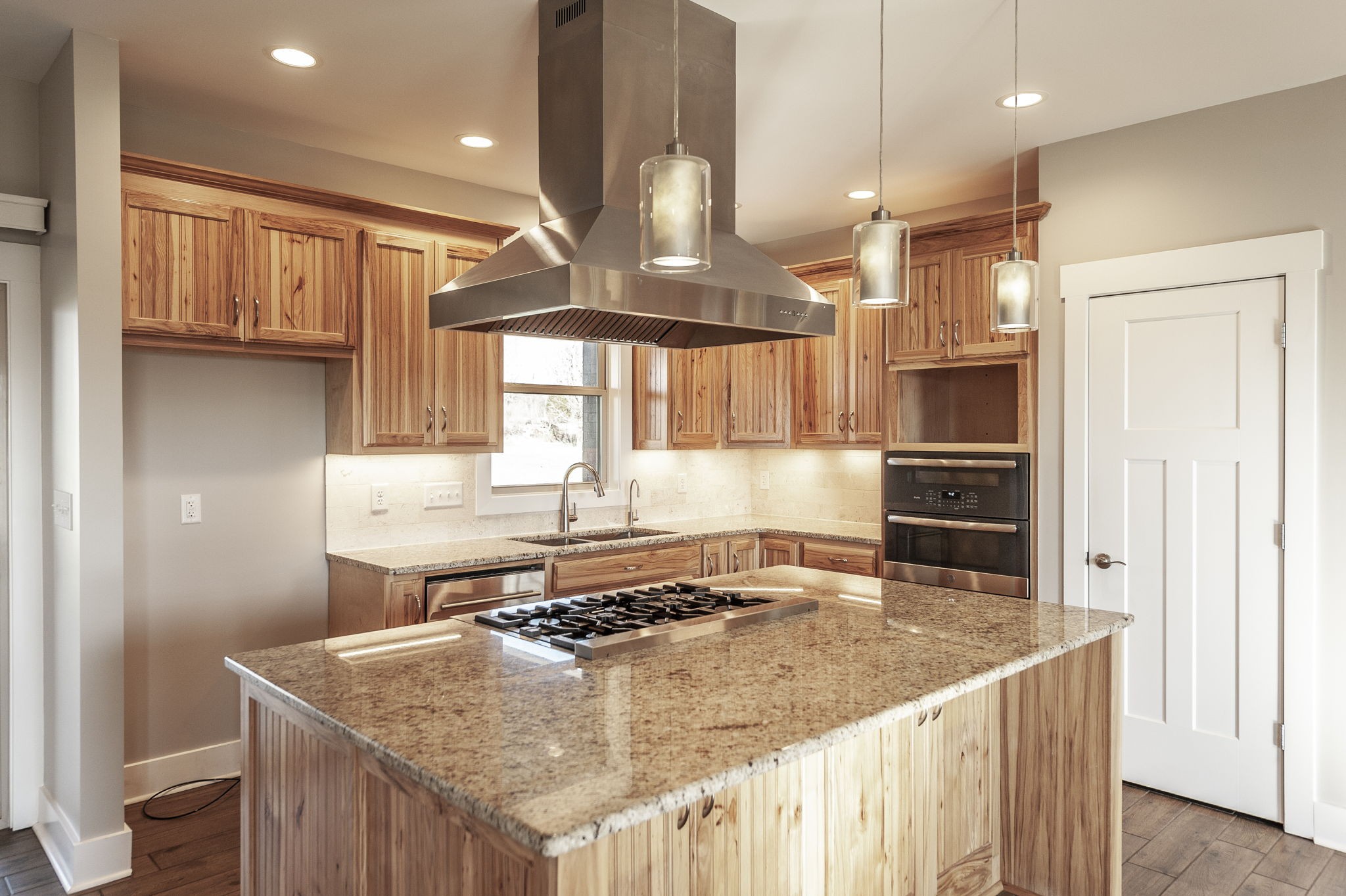 7728 Boyles Road White House, TN 37188 - Photo 25 of 60 a kitchen with a stove a sink a refrigerator and chairs