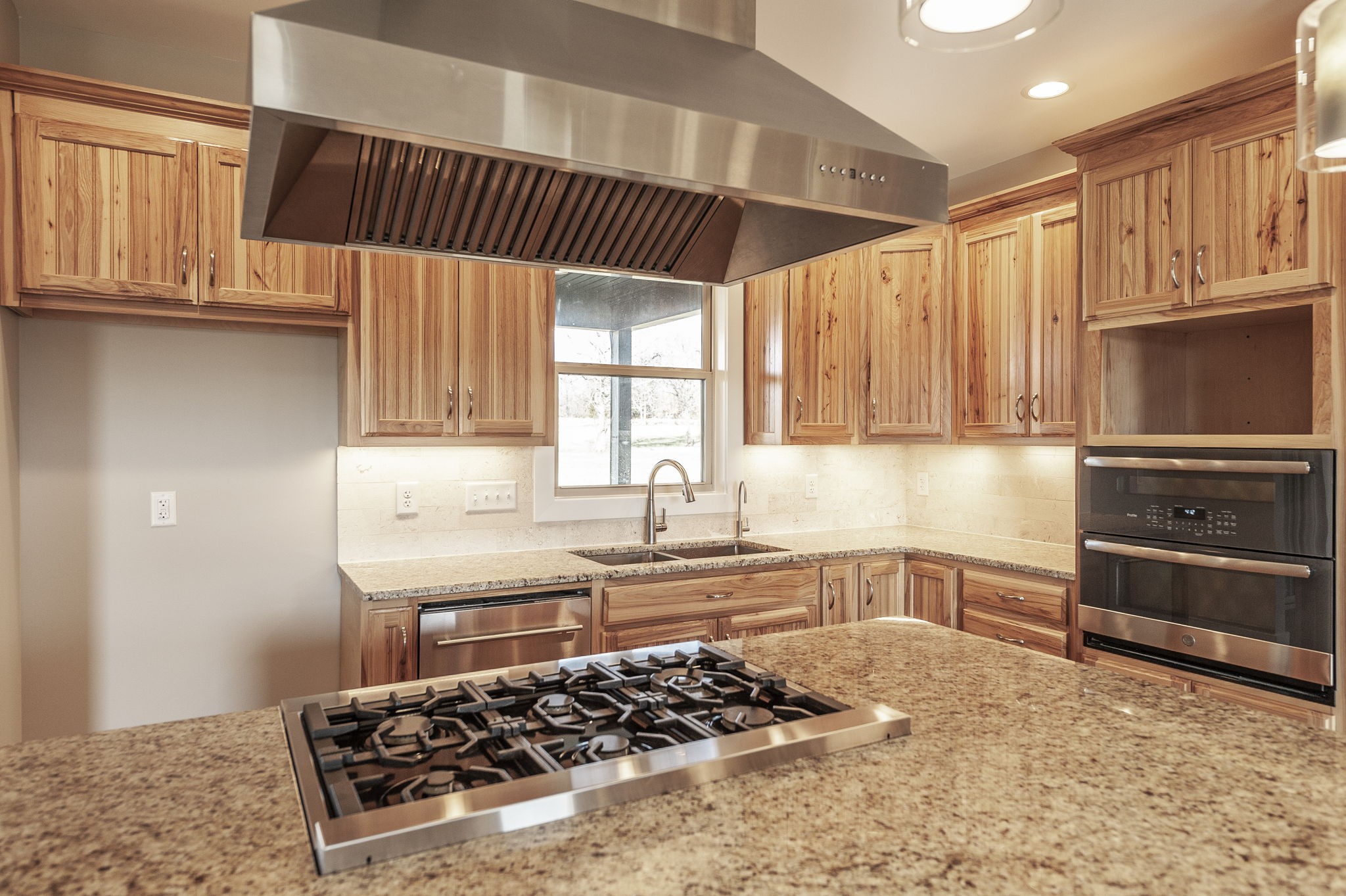 7728 Boyles Road White House, TN 37188 - Photo 28 of 60 a kitchen with stainless steel appliances a stove a sink and a microwave