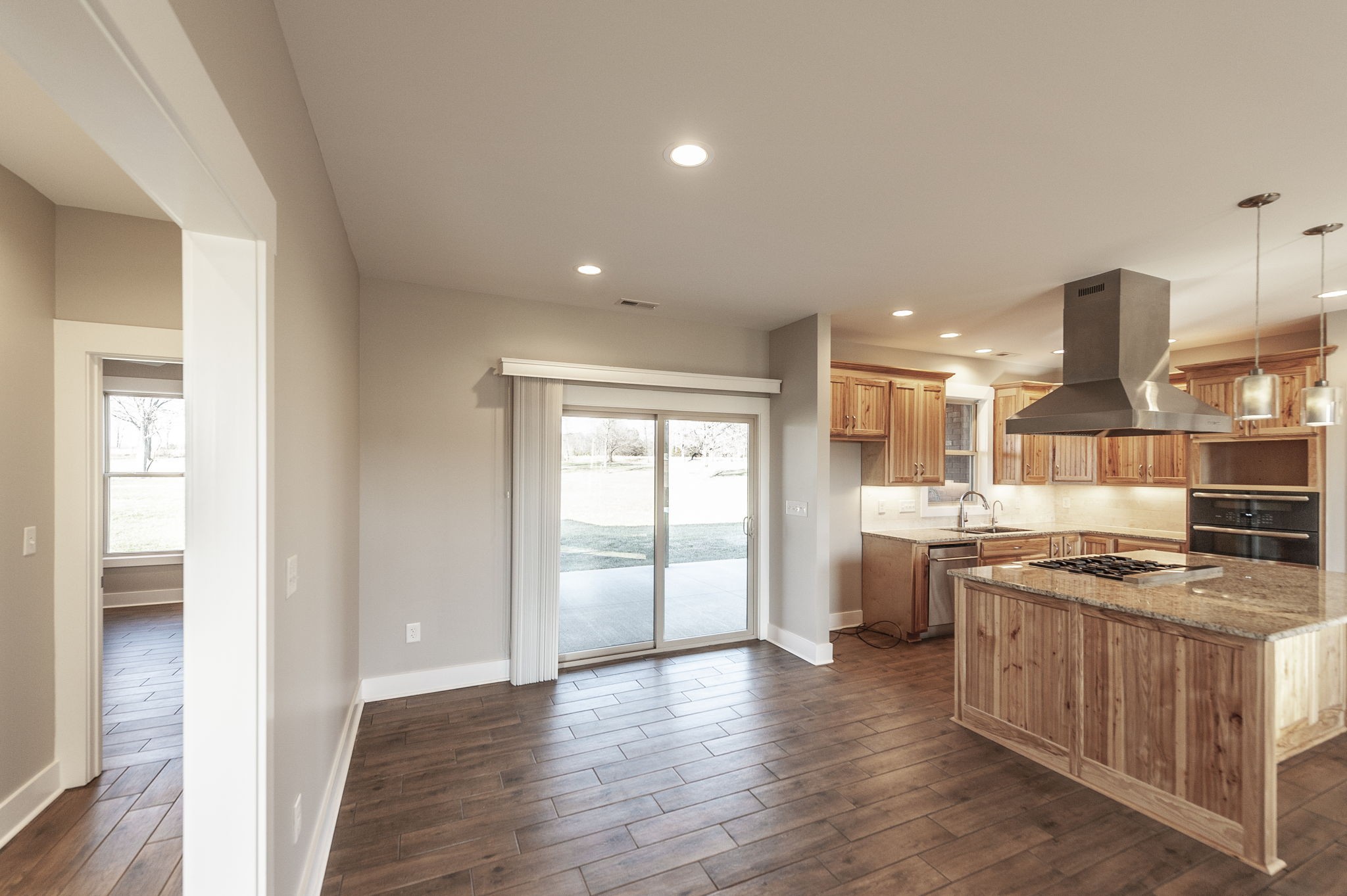 7728 Boyles Road White House, TN 37188 - Photo 33 of 60 a kitchen with stainless steel appliances granite countertop a stove and a refrigerator