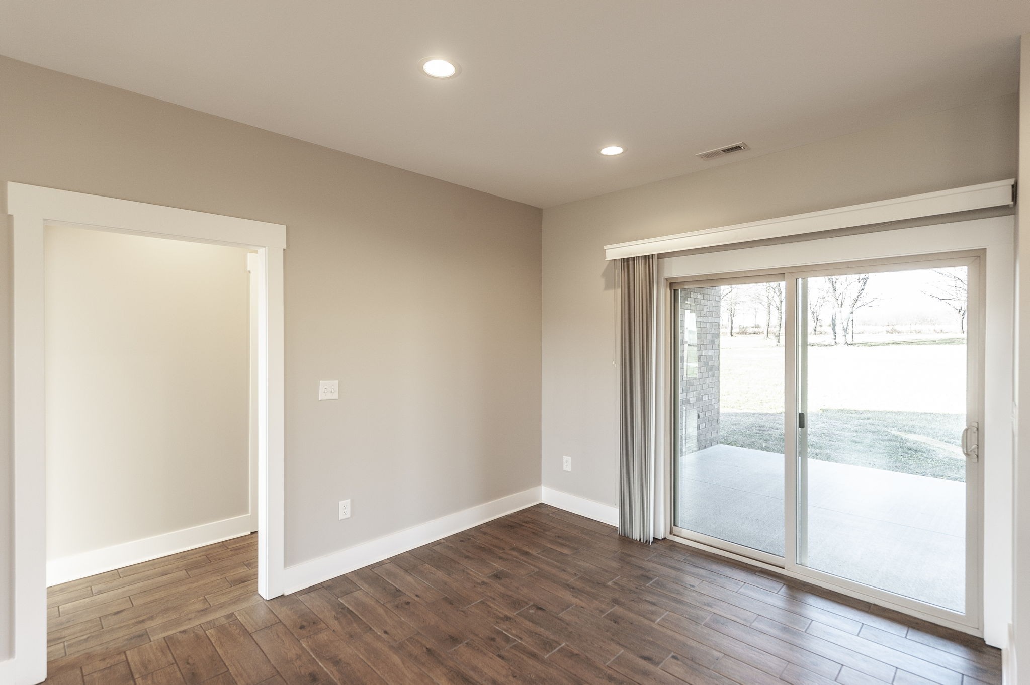 7728 Boyles Road White House, TN 37188 - Photo 34 of 60 a view of an empty room with wooden floor and a window