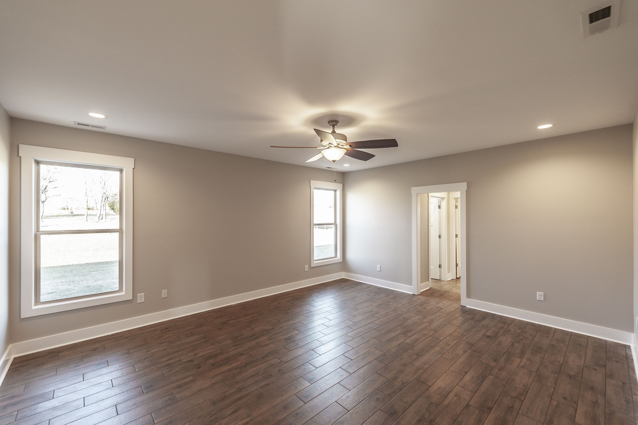 7728 Boyles Road White House, TN 37188 - Photo 35 of 60 a view of an empty room with a window and wooden floor