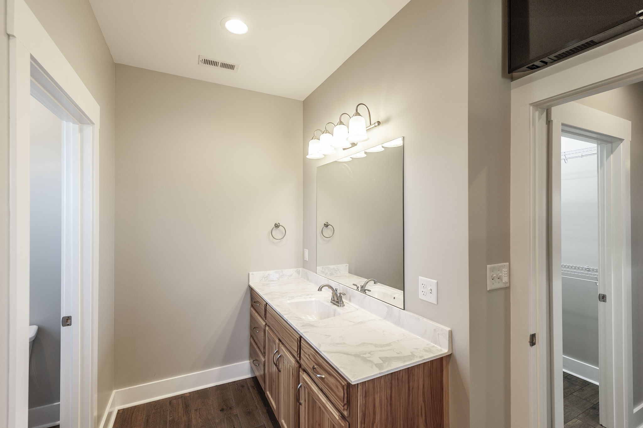 7728 Boyles Road White House, TN 37188 - Photo 41 of 60 a bathroom with a sink vanity and a mirror