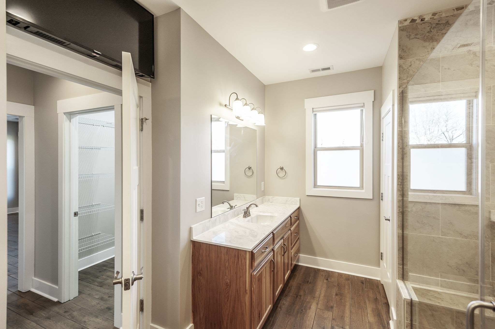 7728 Boyles Road White House, TN 37188 - Photo 42 of 60 a bathroom with a sink mirror and a shower