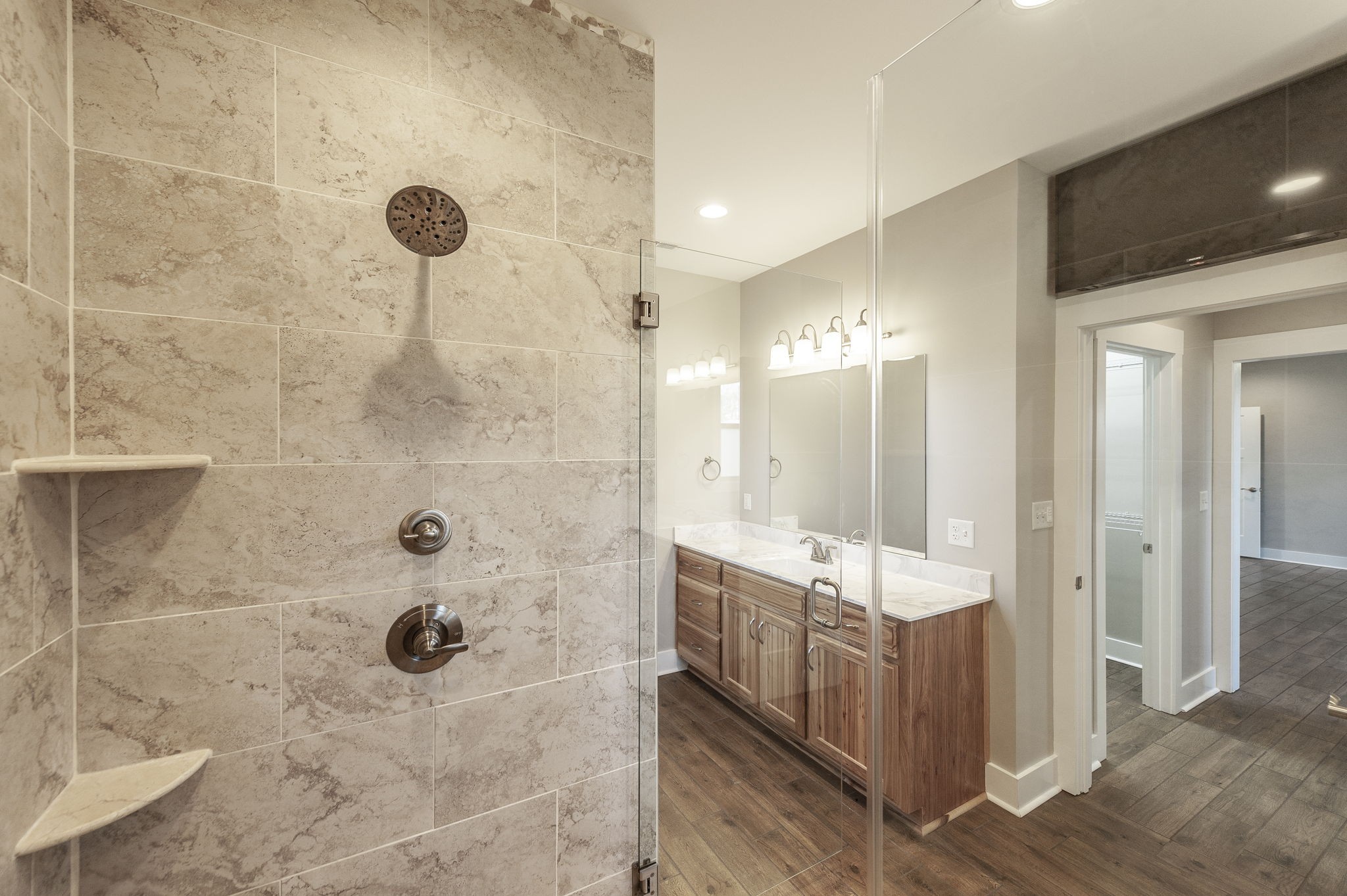 7728 Boyles Road White House, TN 37188 - Photo 44 of 60 a bathroom with a granite countertop sink a mirror and shower