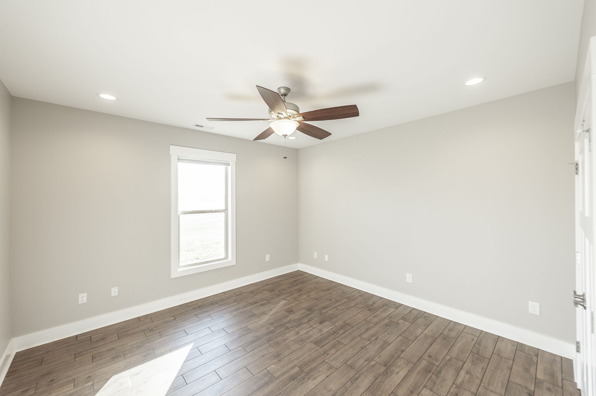 7728 Boyles Road White House, TN 37188 - Photo 51 of 60 an empty room with wooden floor and windows