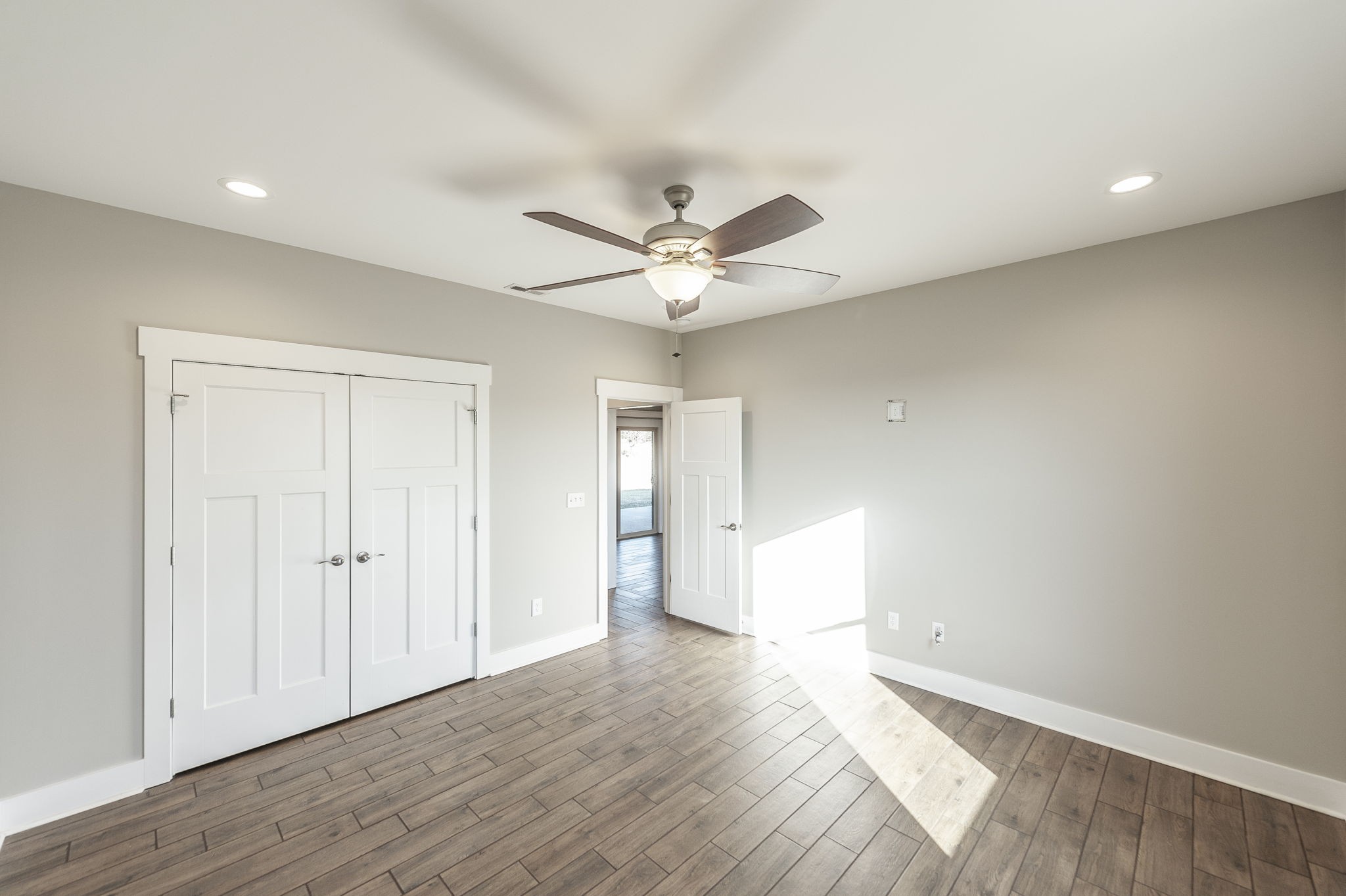 7728 Boyles Road White House, TN 37188 - Photo 52 of 60 an empty room with wooden floor and ceiling fan