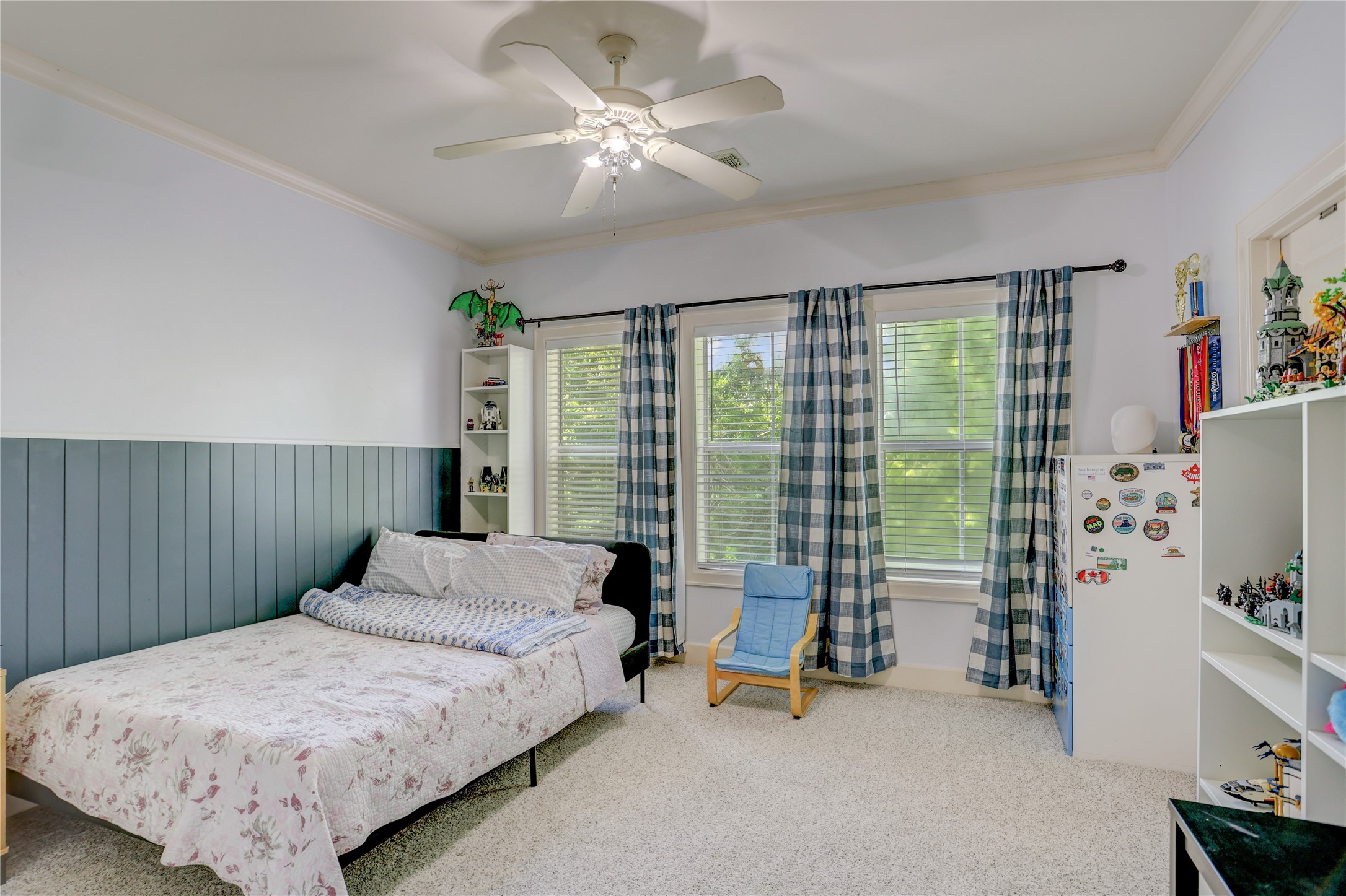 4262 Childress Street, Unit B Houston, TX 77005 - Photo 19 of 22 a bedroom with a bed and a chandelier
