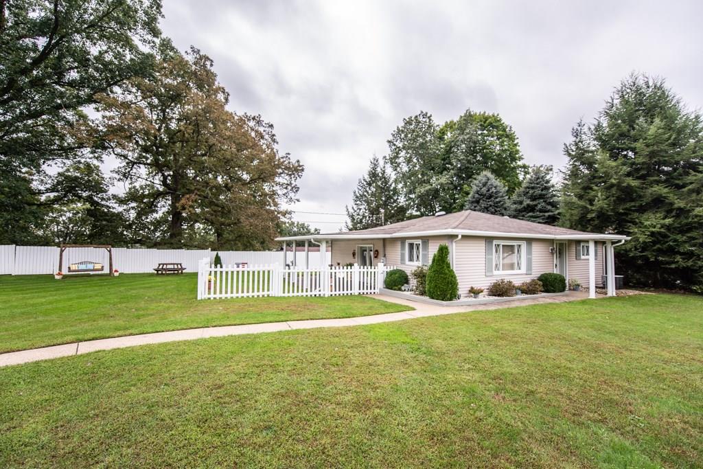 949 Lyn Road Sarver, PA 16055 - Photo 2 of 25 This home features meticulously maintained landscaping. A portion of the large yard is enclosed with a lovely white picket fence. The bench swing and picnic table are included with the sale of the property.
