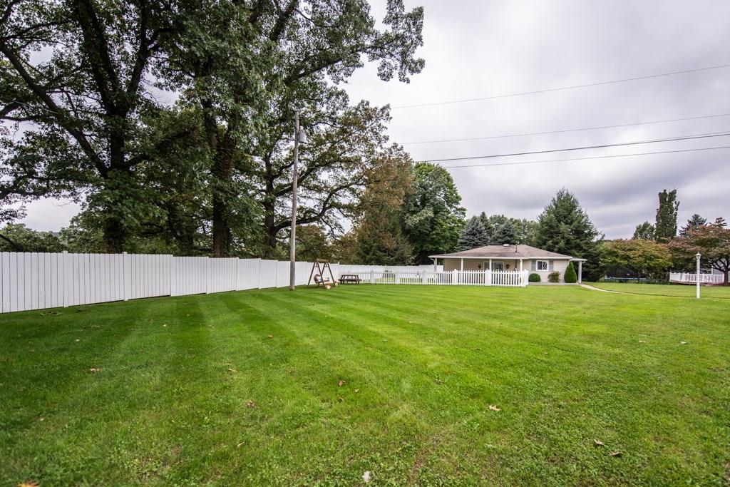 949 Lyn Road Sarver, PA 16055 - Photo 23 of 25 Side of house taken from garage MLS#1371433 or MLS#1371434. The bench swing and picnic table are included with the property.