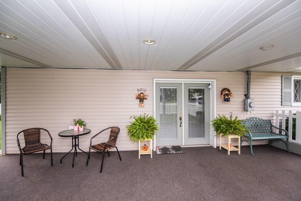 949 Lyn Road Sarver, PA 16055 - Photo 4 of 25 Closer view of the covered side patio. Canned overhead lighting and welcoming french door with blinds between the glass window panes.