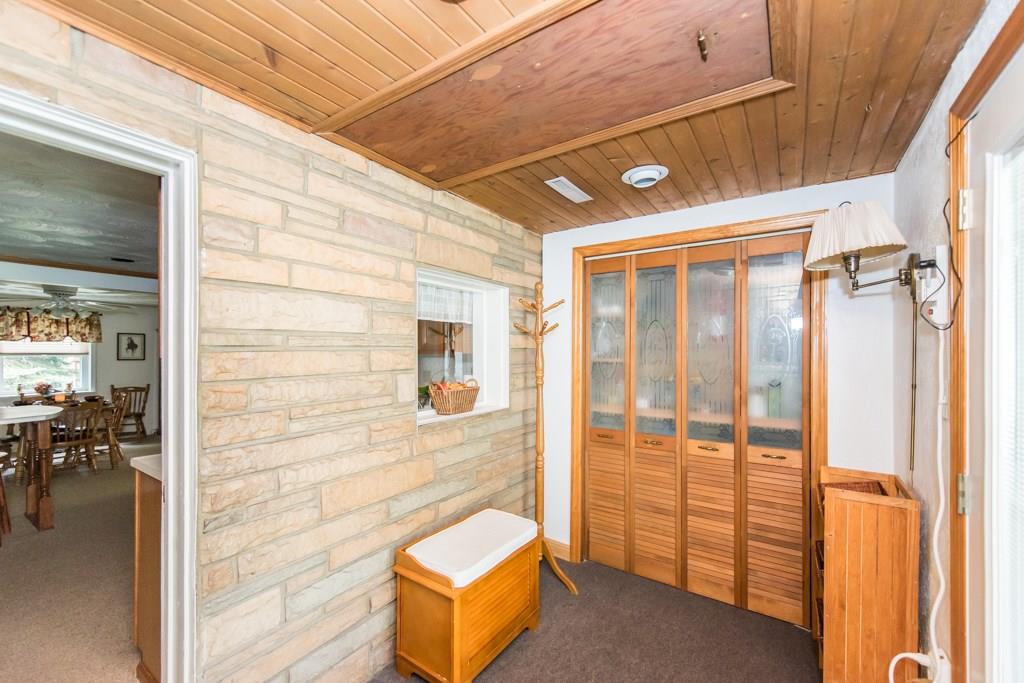 949 Lyn Road Sarver, PA 16055 - Photo 5 of 25 The entry from the patio is a cute "mud room" with closet space. Access to the attic is located here.