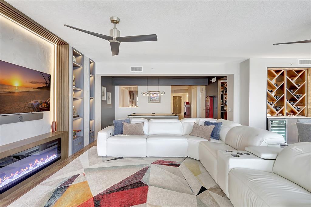 610 Riviera Dunes Way, Unit 602 Palmetto, FL 34221 - Photo 12 of 79 a living room with furniture and a flat screen tv