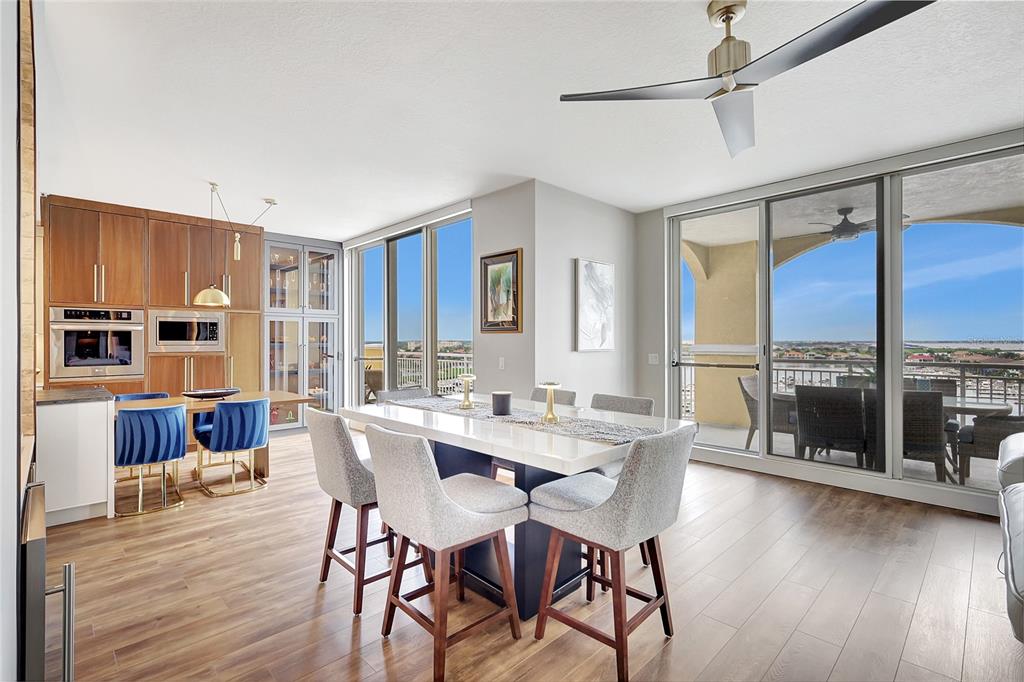 610 Riviera Dunes Way, Unit 602 Palmetto, FL 34221 - Photo 15 of 79 a view of a dining room with furniture window and wooden floor