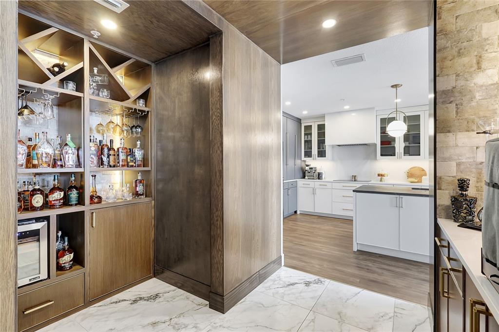 610 Riviera Dunes Way, Unit 602 Palmetto, FL 34221 - Photo 24 of 79 a kitchen with refrigerator and cabinets