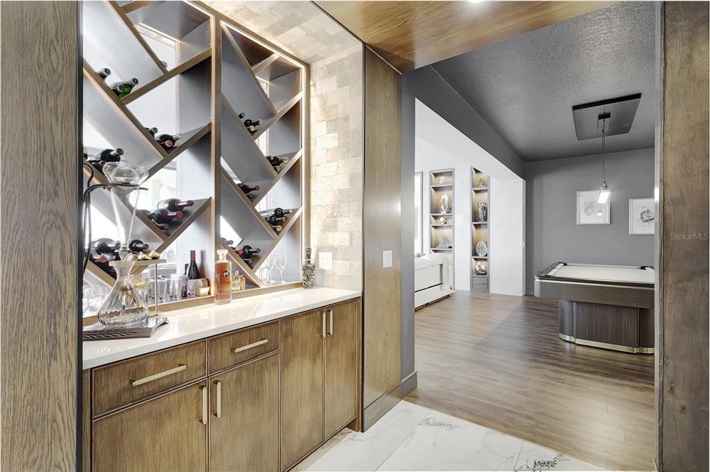 610 Riviera Dunes Way, Unit 602 Palmetto, FL 34221 - Photo 25 of 79 a view of a hallway with wooden floor and a kitchen