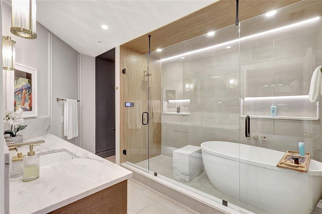 610 Riviera Dunes Way, Unit 602 Palmetto, FL 34221 - Photo 43 of 79 a bathroom with a sink a toilet and shower