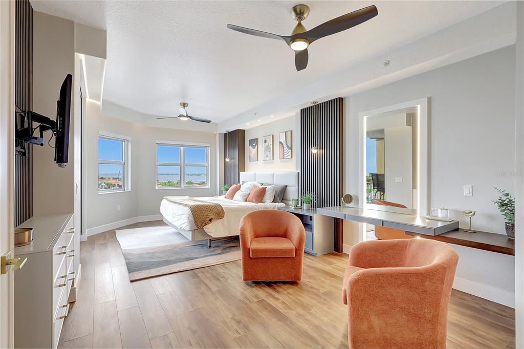 610 Riviera Dunes Way, Unit 602 Palmetto, FL 34221 - Photo 48 of 79 a living room with furniture and a flat screen tv