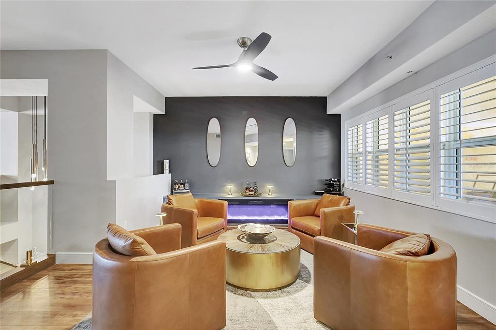 610 Riviera Dunes Way, Unit 602 Palmetto, FL 34221 - Photo 5 of 79 a living room with furniture and a large window