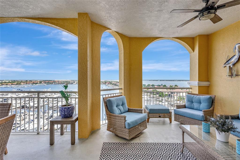 610 Riviera Dunes Way, Unit 602 Palmetto, FL 34221 - Photo 61 of 79 a living room with furniture and a floor to ceiling window