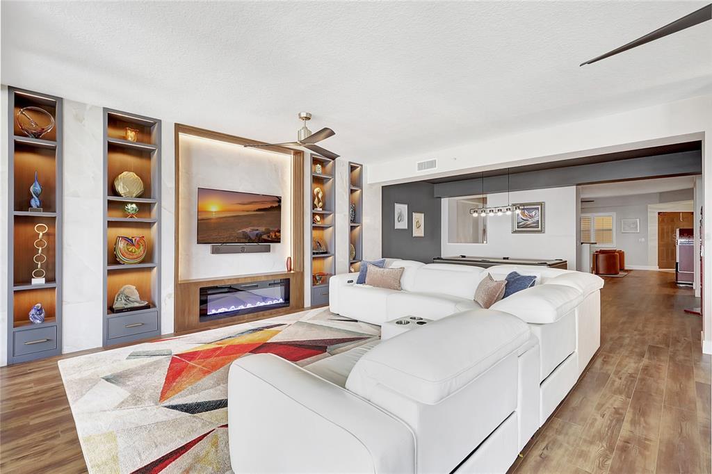 610 Riviera Dunes Way, Unit 602 Palmetto, FL 34221 - Photo 9 of 79 a living room with furniture and a flat screen tv