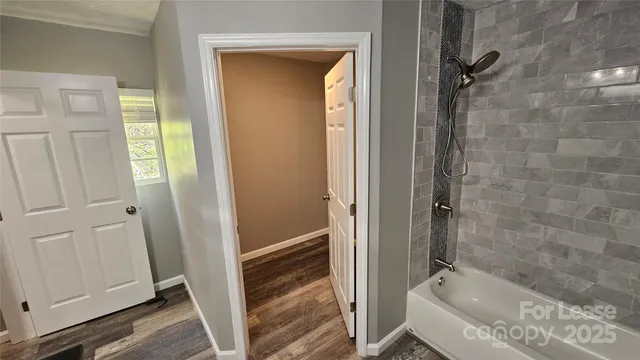 a bathroom with a tub and a sink
