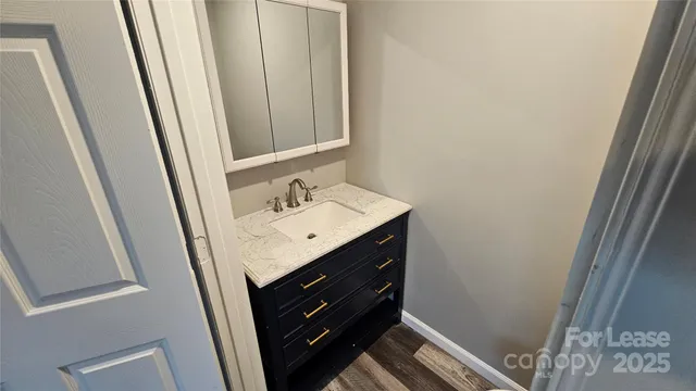a white toilet sitting next to a sink