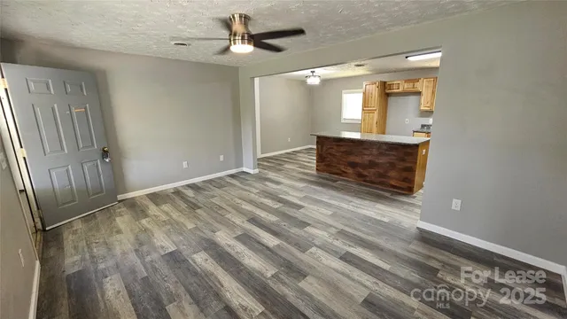 wooden floor in an empty room with a mirror