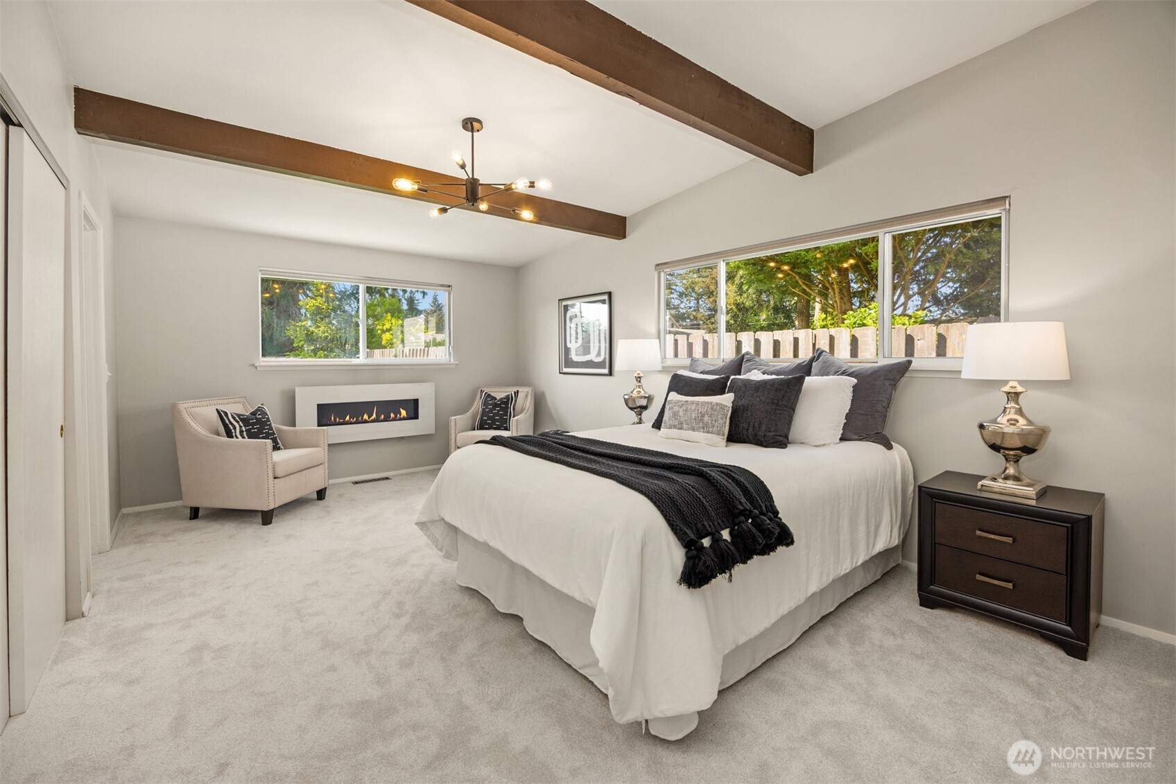 16021 15th Avenue Southwest Burien, WA 98166 - Photo 13 of 36 a spacious bedroom with a bed and a couch