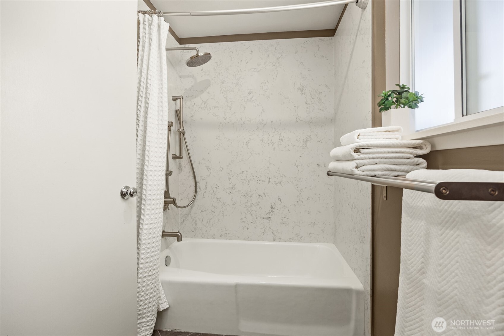 16021 15th Avenue Southwest Burien, WA 98166 - Photo 21 of 36 a bathroom with a bath tub and a shower