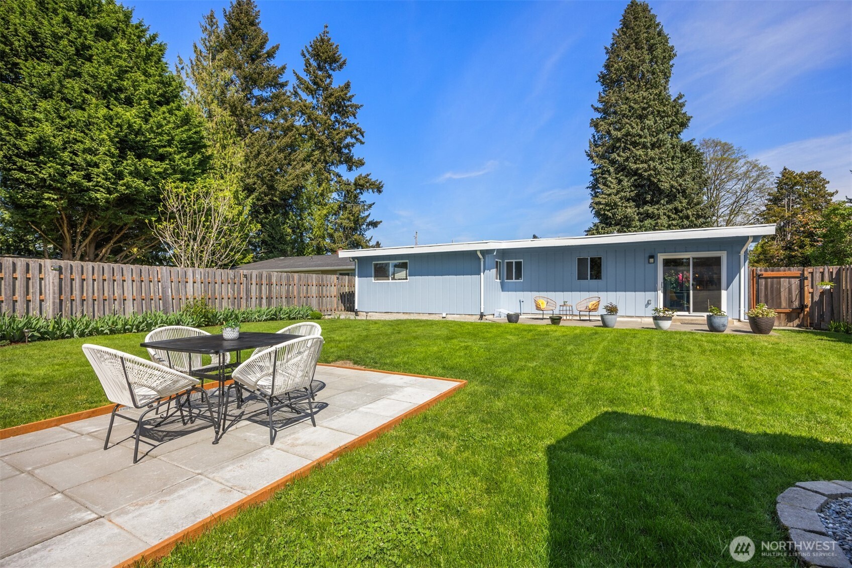 16021 15th Avenue Southwest Burien, WA 98166 - Photo 25 of 36 a view of a house with backyard and sitting area