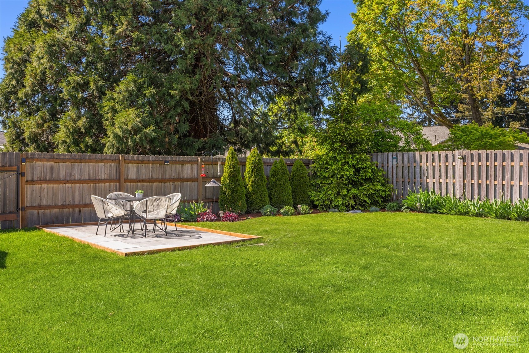 16021 15th Avenue Southwest Burien, WA 98166 - Photo 27 of 36 a view of a chair and table in the garden