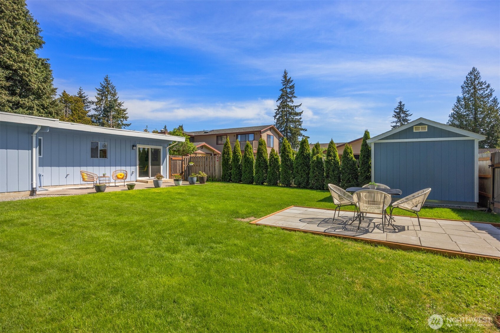 16021 15th Avenue Southwest Burien, WA 98166 - Photo 28 of 36 a view of a house with backyard sitting area and garden