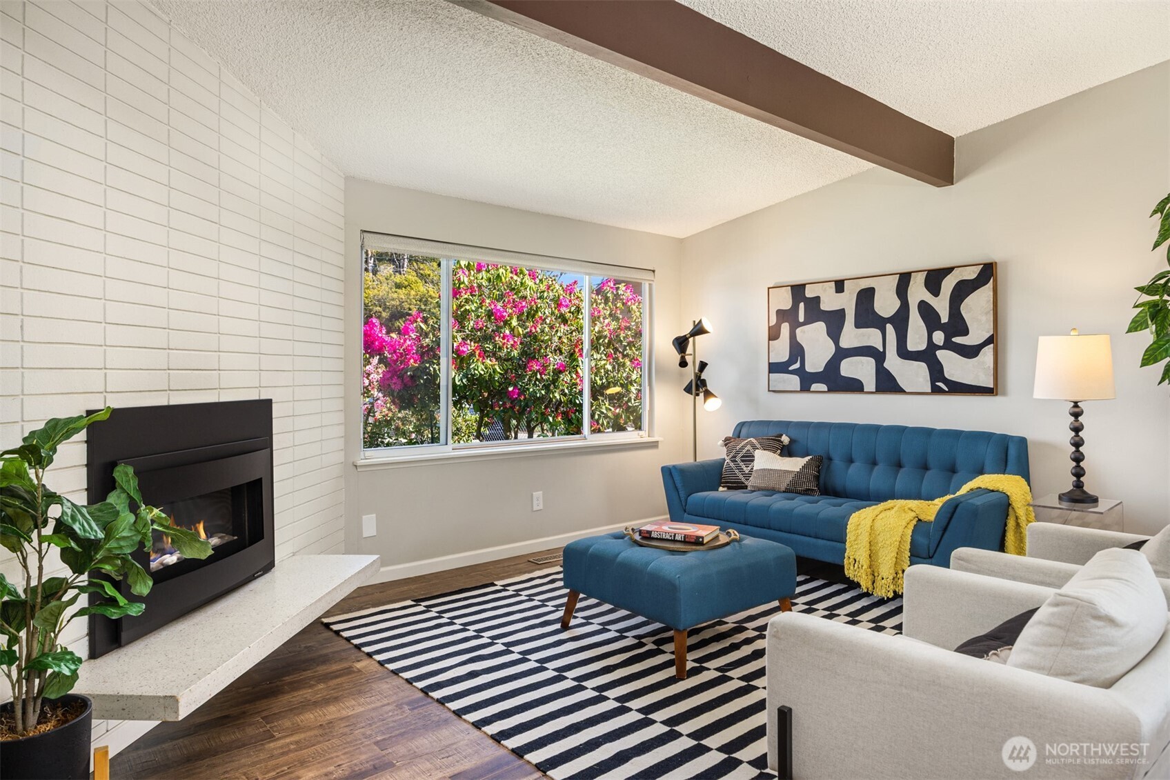 16021 15th Avenue Southwest Burien, WA 98166 - Photo 5 of 36 a living room with furniture a fireplace and a potted plant