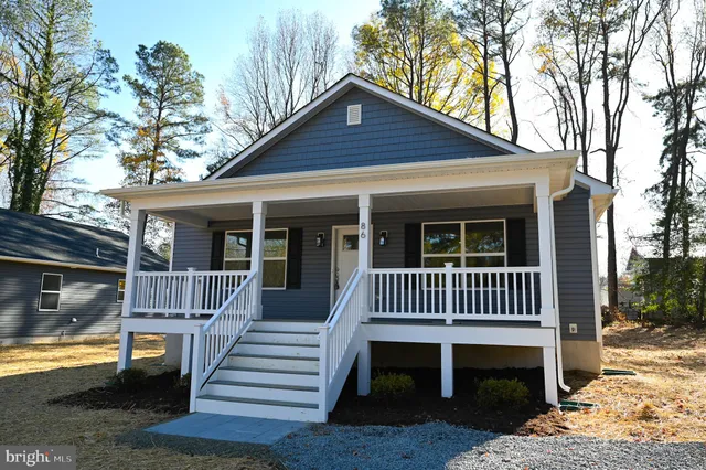 a view of a chair and table in the patio