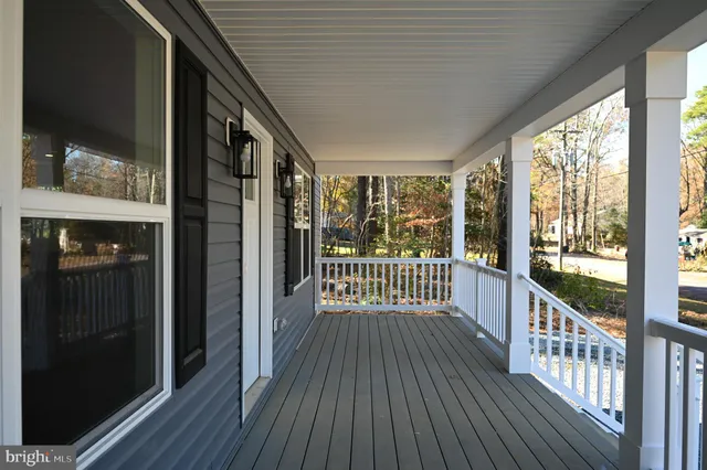 a view of a balcony with wooden floor