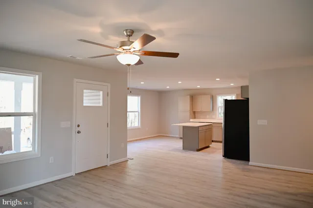 a view of a kitchen with a sink and a window