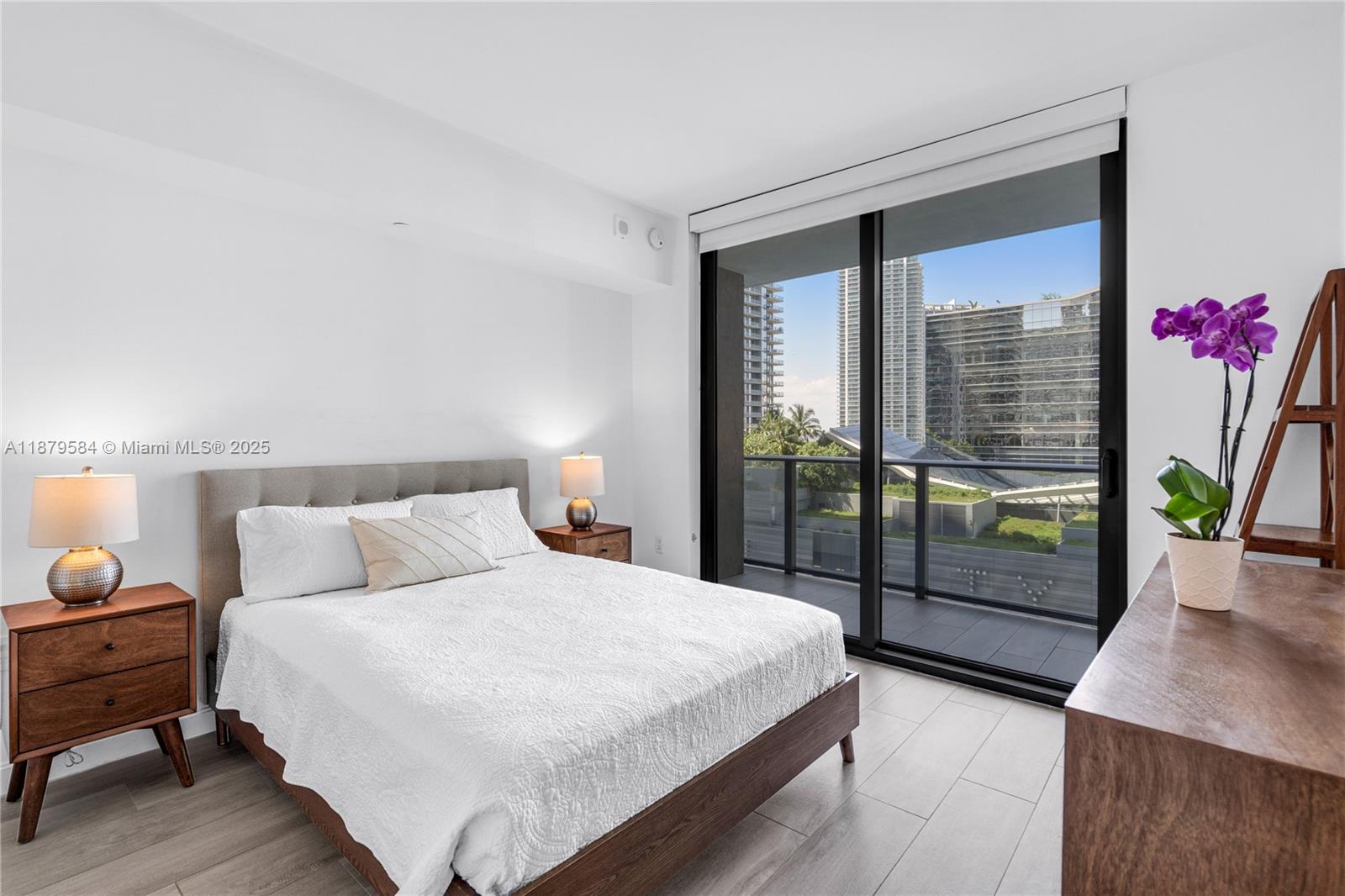 45 Southwest 9th Street, Unit 1001 Miami, FL 33130 - Photo 13 of 40 a bedroom with a bed and large window with outer view