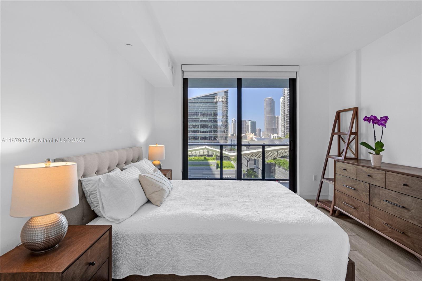 45 Southwest 9th Street, Unit 1001 Miami, FL 33130 - Photo 14 of 40 a bedroom with a bed and window