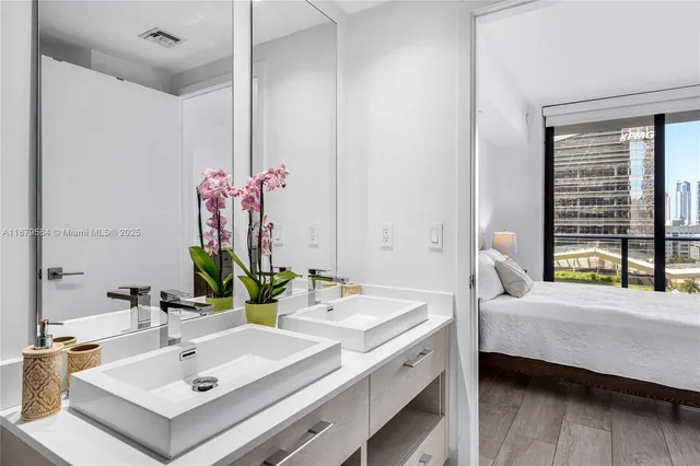 a en suite bathroom with a sink and a mirror