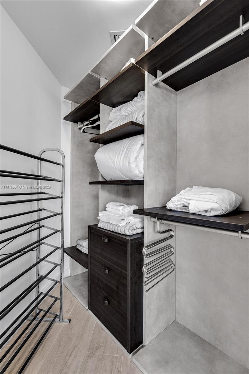 45 Southwest 9th Street, Unit 1001 Miami, FL 33130 - Photo 19 of 40 a kitchen with a stove and cabinets