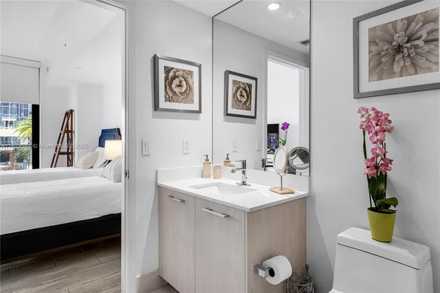 a bathroom with a sink vanity and a mirror