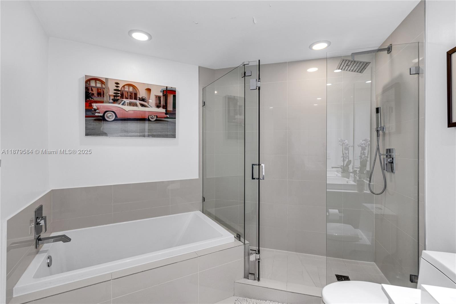 45 Southwest 9th Street, Unit 1001 Miami, FL 33130 - Photo 24 of 40 a bathroom with a tub and shower