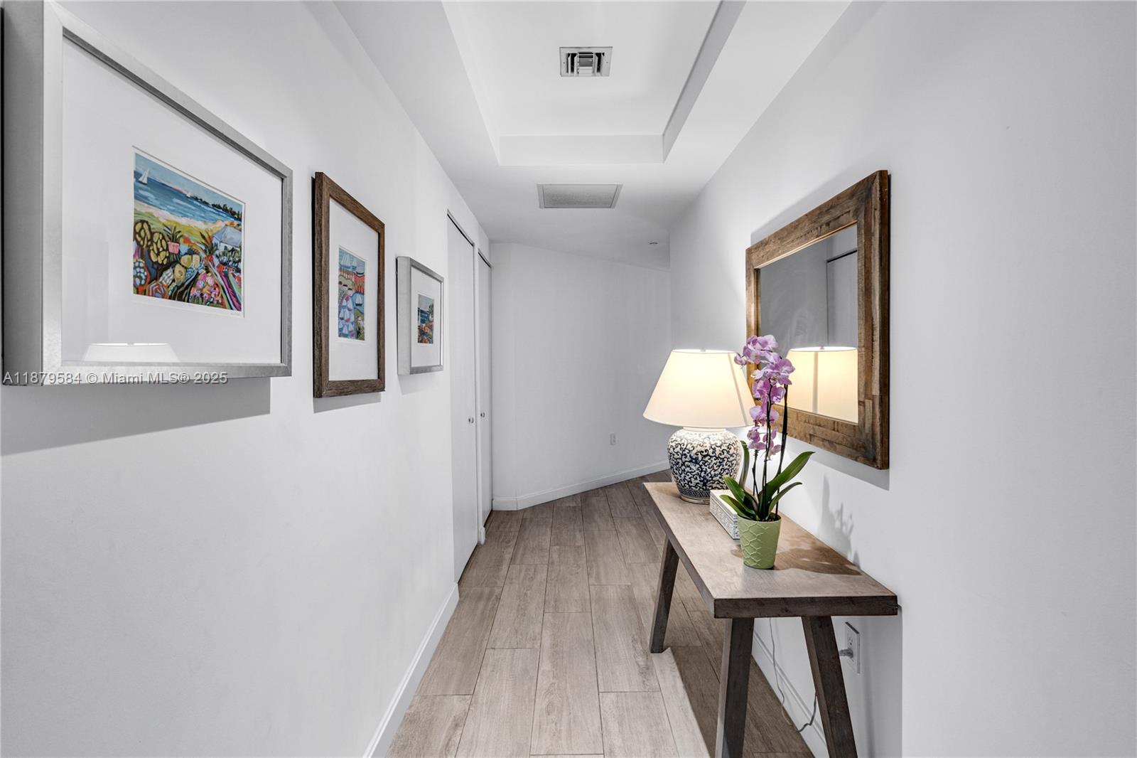45 Southwest 9th Street, Unit 1001 Miami, FL 33130 - Photo 5 of 40 a living room with furniture and a chandelier